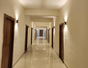 a hallway of a building with a row of stalls at Omisha Stay & Pavilion in Sehore +1 photo