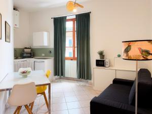 a living room with a couch and a table at Ponticello Mare - HelloElba in Portoferraio