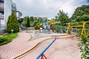 a park with a playground with a slide at Hotel Fiesta in Golden Sands