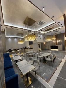 a restaurant with tables and chairs in a room at Elysia Plus Hotel in Istanbul