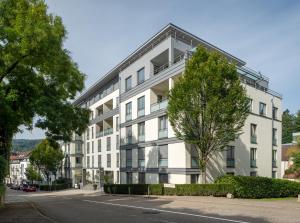 an apartment building on the side of a street at Aqua Aurelia Suitenhotel an den Thermen in Baden-Baden