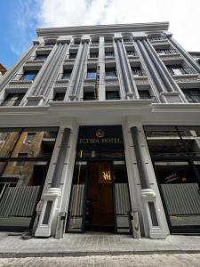 a building with the embassy hotel in front of it at Elysia Plus Hotel in Istanbul