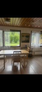 a dining room with a table and two chairs at Martan Porti Three-bedroom house in Imatra