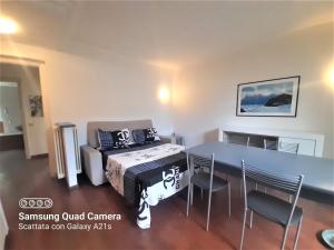 a room with a table and a bed and chairs at host di Elena in Lesmo