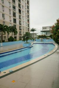 a large swimming pool in the middle of a building at M&B Urban Haven in Suba
