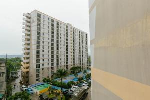 a view of a large building with a parking lot at M&B Urban Haven in Suba