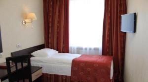 a hotel room with a bed and a window at pokojówka,WiFi,parking P in Poznań