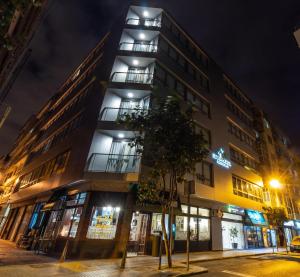 a building on a street at night at URBANSEA Atlanta in Las Palmas de Gran Canaria