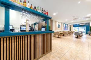 a bar in a restaurant with tables and chairs at URBANSEA Atlanta in Las Palmas de Gran Canaria +19 photos