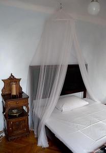 En eller flere senge i et værelse på Casa di Rose
