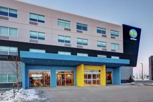 a building with a walmart sign on the front at Tru By Hilton Edmonton Windermere in Edmonton