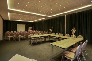 a conference room with tables and chairs in it at Doubletree By Hilton Ben Guerir Hotel & Residences in Benguerir +52 photos