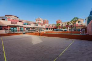 an empty parking lot in front of a building at BLUESEA Aloe Corralejo in Corralejo