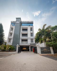 a tall white building with a lot of windows at Dreamscape Banjara Hills in Hyderabad