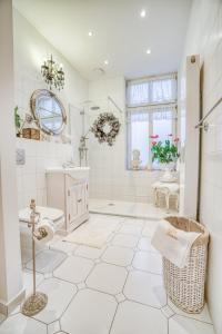 a white bathroom with a shower and a sink at Apartament ASSER - 110 m2 komfortu in Pszczyna +42 photos