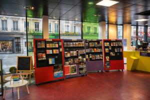 a book store with a bunch of books on display at Mulhouse City Loft in Mulhouse