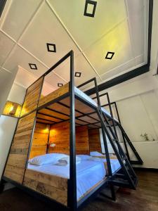a bedroom with a bunk bed in a room at Yellow Umbrella Hostels in Cebu City +8 photos