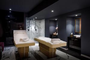 a bathroom with a shower and a sink with towels at Hotel Imperial - by Liburnia Hotels & Villas in Opatija +51 photos