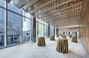 a large room with tables and large windows at Waldorf Astoria Las Vegas in Las Vegas +114 photos