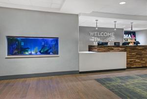 a lobby with a welcome to the department of the exhibit at Hampton Inn Westfield in Westfield