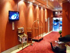 a room with a tv on the corner of a wall at Al Zahabiya Hotel Apartments in Dubai