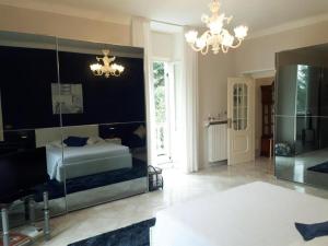 a bedroom with a bed and a large mirror at Residenza Villa Gorìa in Pontestura +57 photos