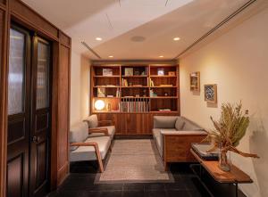 a living room with a couch and a table at Umbral, Curio Collection By Hilton in Mexico City
