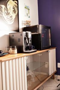 a microwave sitting on top of a wooden counter at Ceo Lofts & Studios Premium in Aracaju