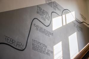 a wall with a drawing of a lamp on it at Central Hostel in Riga +22 photos