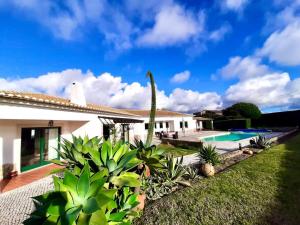 a villa with a swimming pool and a house at Villa Mar & Surf • Piscina privada in Atouguia da Baleia