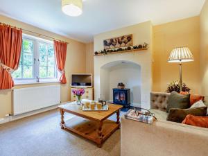 a living room with a couch and a table at 2 Bed in Alford oc-92252 in Rigsby