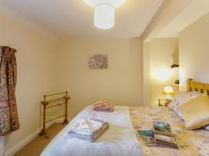 a bedroom with a bed with towels on it at 2 Bed in Alford oc-77637 in Rigsby