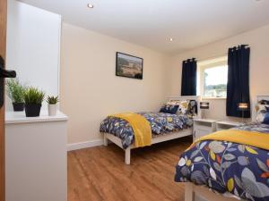 a bedroom with two beds and a window at 3 Bed in Alford oc-55963 in Rigsby