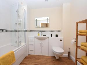 a bathroom with a sink and a toilet and a shower at 3 Bed in Alford oc-55963 in Rigsby +24 photos
