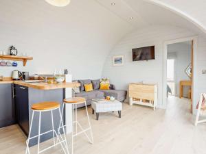 a living room with a couch and a table at 2 Bed in Tain oc-81339 in Nigg