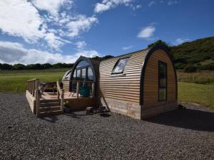 a tiny house sitting on top of a pile of gravel at 2 Bed in Tain oc-81339 in Nigg
