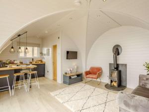 a kitchen and living room with an arched ceiling at 1 Bed in Tain oc-81337 in Nigg