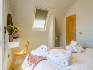 a room with a bed with towels on it at 1 Bed in Tain oc-81337 in Nigg