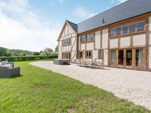 an exterior view of a house with a patio at 4 Bed in Wrexham oc-87675 in Chirk