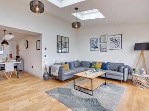 a living room with a couch and a table at 2 Bed in Anstruther oc-66733 in Pittenweem +22 photos