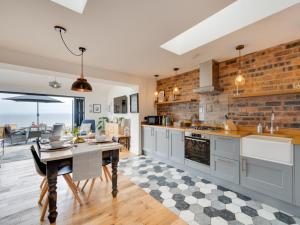 a kitchen with a table and a dining room at 2 Bed in Anstruther oc-66733 in Pittenweem