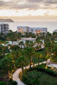 an aerial view of a resort with palm trees and the ocean at Conrad Punta de Mita in Punta Mita
