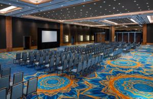 a conference room with chairs and a screen at Conrad Punta de Mita in Punta Mita +104 photos