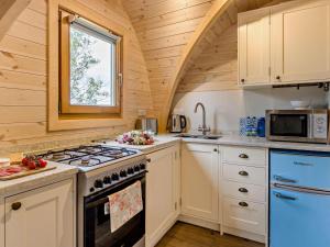 a kitchen with a stove and a window at 1 Bed in Shrewsbury oc-93394 in Leighton +11 photos