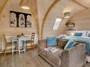 a room with a couch and a bed and a table at 1 Bed in Shrewsbury oc-93394 in Leighton