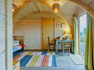 a room with a bed and a table in a cabin at 1 Bed in Shrewsbury oc-93395 in Leighton +9 photos