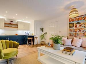 a living room with a couch and a table at 1 Bed in Cirencester oc-90128 in Cirencester