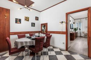 a dining room with a table and chairs at Apartment Audrey - free parking by Irundo in Rijeka