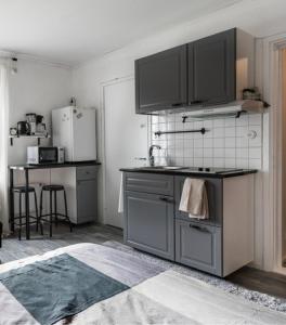 a kitchen with a sink and a counter top at Cozy Studio - 7 min to Tampere Airport - Free Parking in Pirkkala
