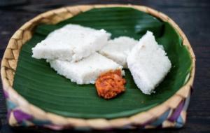 a green plate of food on a wooden table at Vintage Voyage Villa in Negombo +23 photos